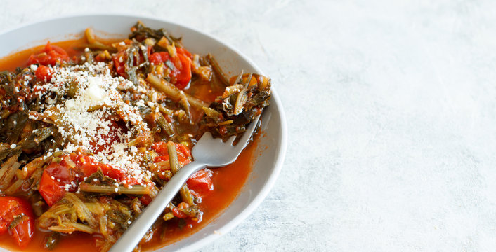Sauteed green cicory and tomatoes
