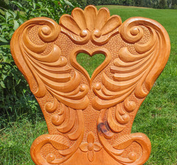 Wooden chair with heart shape. 