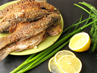 Fish fried on a black background