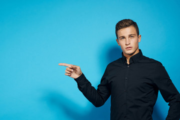 emotional man in black shirt studio lifestyle blue isolated background