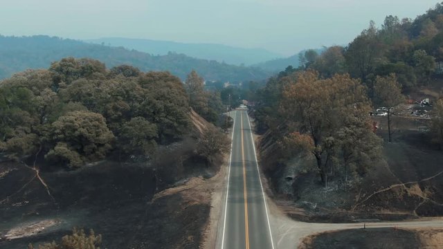 Napa, California, USA. 22 August 2020. Aerial over road & burnt forest and farmland in the LNU Lightning Complex Fire that ravaged the Napa, Sonoma, Lake and Solano counties.