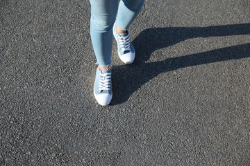 Woman walking outdoors, closeup with space for text. Choosing way concept.