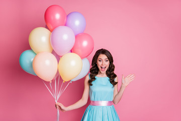 Portrait of her she nice-looking attractive pretty lovely elegant amazed cheerful cheery wavy-haired girl holding in hand bunch balls having fun isolated over pink pastel color background