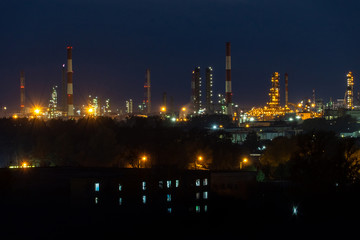 Fototapeta na wymiar oil refinery lights against the night sky