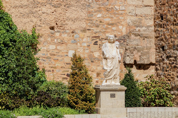 old marble statue in medieval background