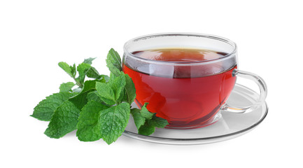 Cup with hot aromatic mint tea and fresh leaves isolated on white