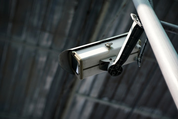surveillance camera or CCTV security camera in factory, shallow depth of field
