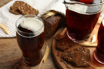 Delicious kvass, bread and spikes on wooden table