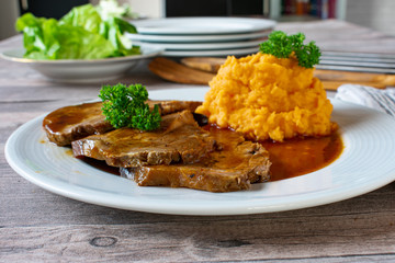 Pork with sweet potatoes and gravy
