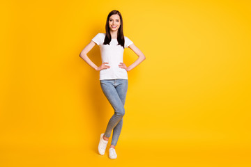 Fototapeta na wymiar Full size photo of content nice sweet girl put hands waist enjoy weekend holiday wear casual style clothes white shoes isolated over shine color background