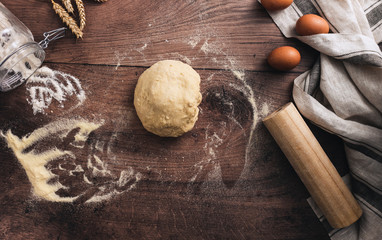 dough with rolling pin and flour