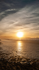 Naklejka premium Sunset by the beach