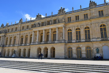 Obraz premium Versailles, France - May 02, 2018: Palace of Versailles, not far away from Paris. It is one of the most visited attractions in France. Great cloudy blue sky,