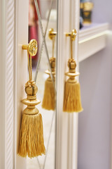 Decorative elements of classic cabinet in wardrobe