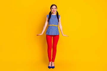 Full length body size view of her she nice-looking attractive pretty lovely cheerful cheery modest fashionable feminine girl posing isolated bright vivid shine vibrant yellow color background