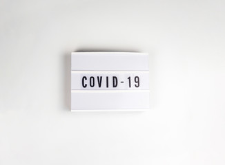 Covid-19 text on banner on white background