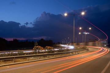 Fototapeta na wymiar Car light trail long exposure at highway orange lights