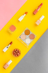Flat lay of decorative cosmetics on color background. Above view
