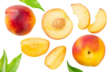 peach fruits with green leaf and slices isolated on white background. top view