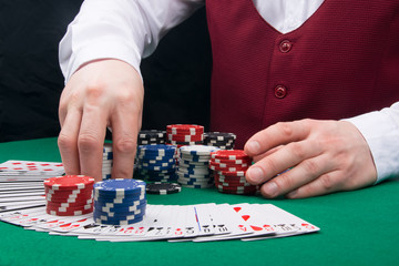 the croupier gives the winnings to the client after a successful poker game