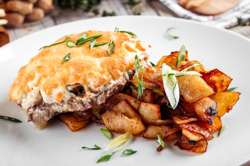 Grilled cheese cutlet with roasted potatoes