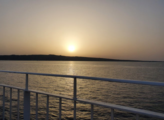 Sunset from the italian bridge to the sea