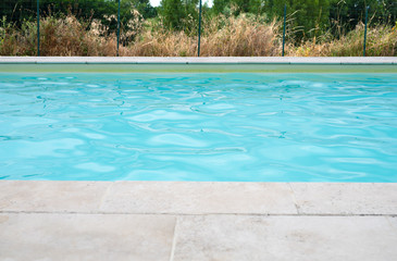 Section of swimming pool with stone surround