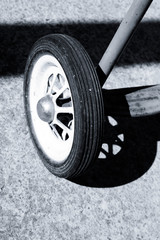 Photo of a wheel of an old children's bicycle.