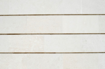 New white stone slabs on wall closeup