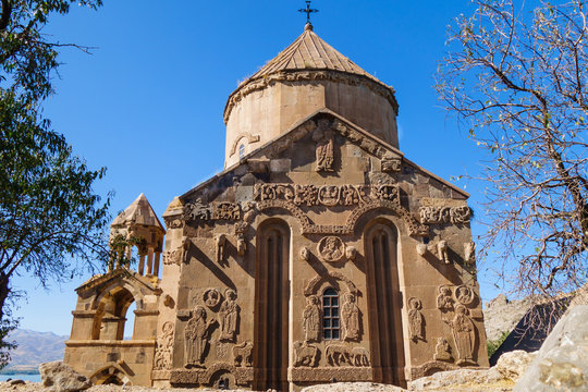 Eastern side of medieval Armenian Cathedral of Holy Cross & its bas-reliefs, Akdamar island, Van Lake, Gevaş Turkey. Church is richly decorated by bas-reliefs. It was built in 921 as church for king