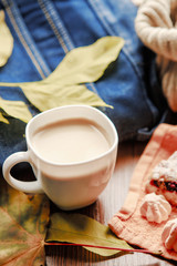 a cup of hot coffe with marshmellow in the autumn workflow banner. Vrtical orientation. Selective focus