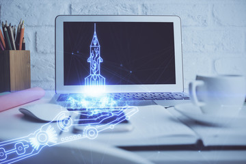 Desktop computer background in office and start up theme hologram drawing. Double exposure. Startup...