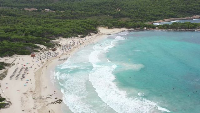 Flying a drone over the beach of Cala Agulla in the northeast of the island of Majorca Spain