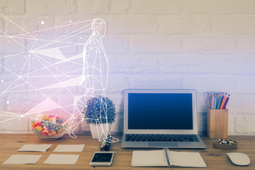 Desktop computer background in office and start up theme hologram drawing. Double exposure. Startup concept.