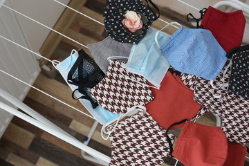 Many cotton face mask laying on the drying rails. Handmade cloth face mask against coronavirus.