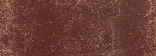 old scratched worn brown leather background and texture