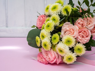 Wedding bouquet of pink roses and chrysanthemums.