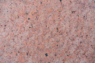 Wall texture decorative with black and white stone in pink concrete cement wall.