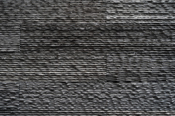 Black bricks slate texture background, slate stone wall texture.