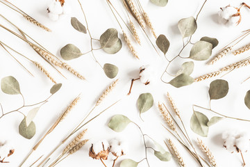 Autumn composition. Dried leaves, flowers on white background. Autumn, fall, thanksgiving day...