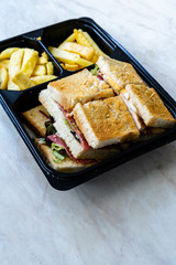 Take Away Club Sandwich with Potatoes Fast Food Menu in Plastic Container / Table d'hote.