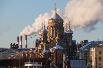 Winter cityscape of the Lieutenant Schmidt embankment in St. Petersburg with a sailboat in the winter parking lot and a view of the Assumption Church