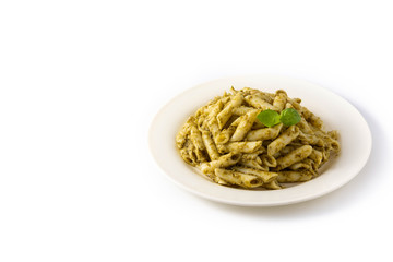 Penne pasta with pesto sauce isolated on white background. Copy space