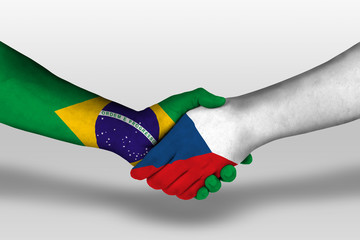 Handshake between czech republic and brazil flags painted on hands, illustration with clipping path.