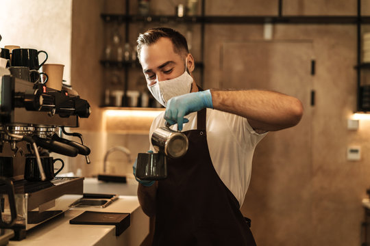 barista equipped with a protective mask for the virus - Powered by Adobe