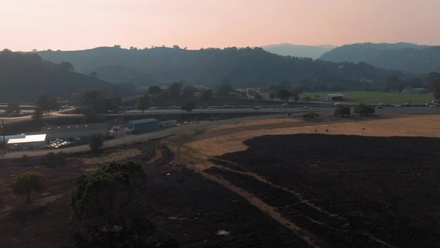 Vacaville, California, USA. 22 August 2020. Freeway traffic and burnt hills on the Interstate 80. LNU Lightning Complex Fire that ravaged the Napa, Sonoma, Lake and Solano counties.