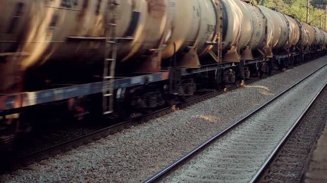 Electric Locomotive With Wagons Rides On Steel Railway.Heavy Industry Transportation Concept.Cargo Train Moving On Platform Staion.Kiev City Logictics.Freight Train Passing Through Passenger Station.