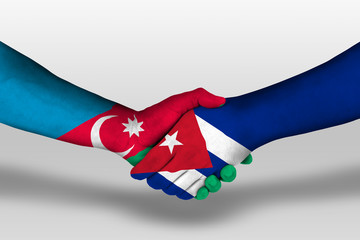 Handshake between cuba and azerbaijan flags painted on hands, illustration with clipping path.