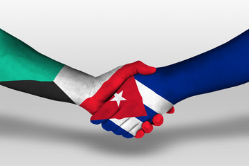 Handshake between cuba and kuwait flags painted on hands, illustration with clipping path.