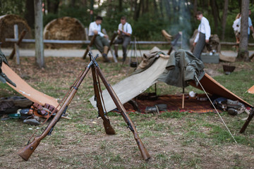 Guns from I Word War with a military camp in the background